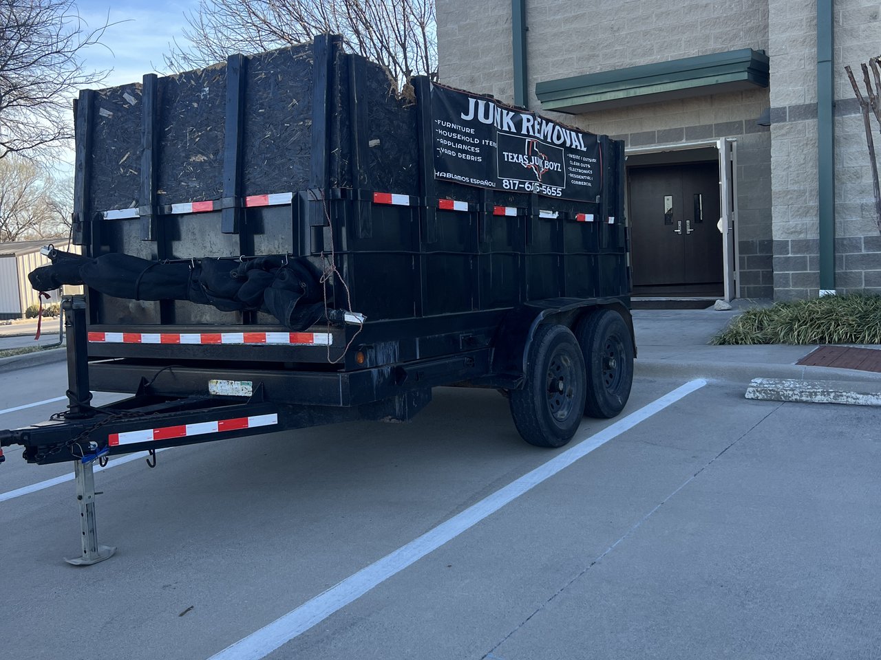 Texas Junk Boyz crew clearing out a commercial office space