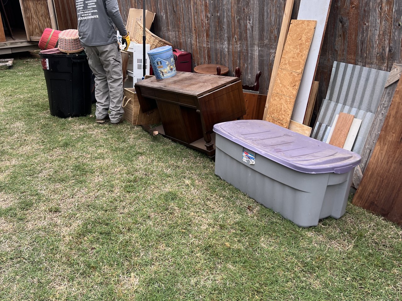 Texas Junk Boyz crew emptying and dismantling a backyard storage shed