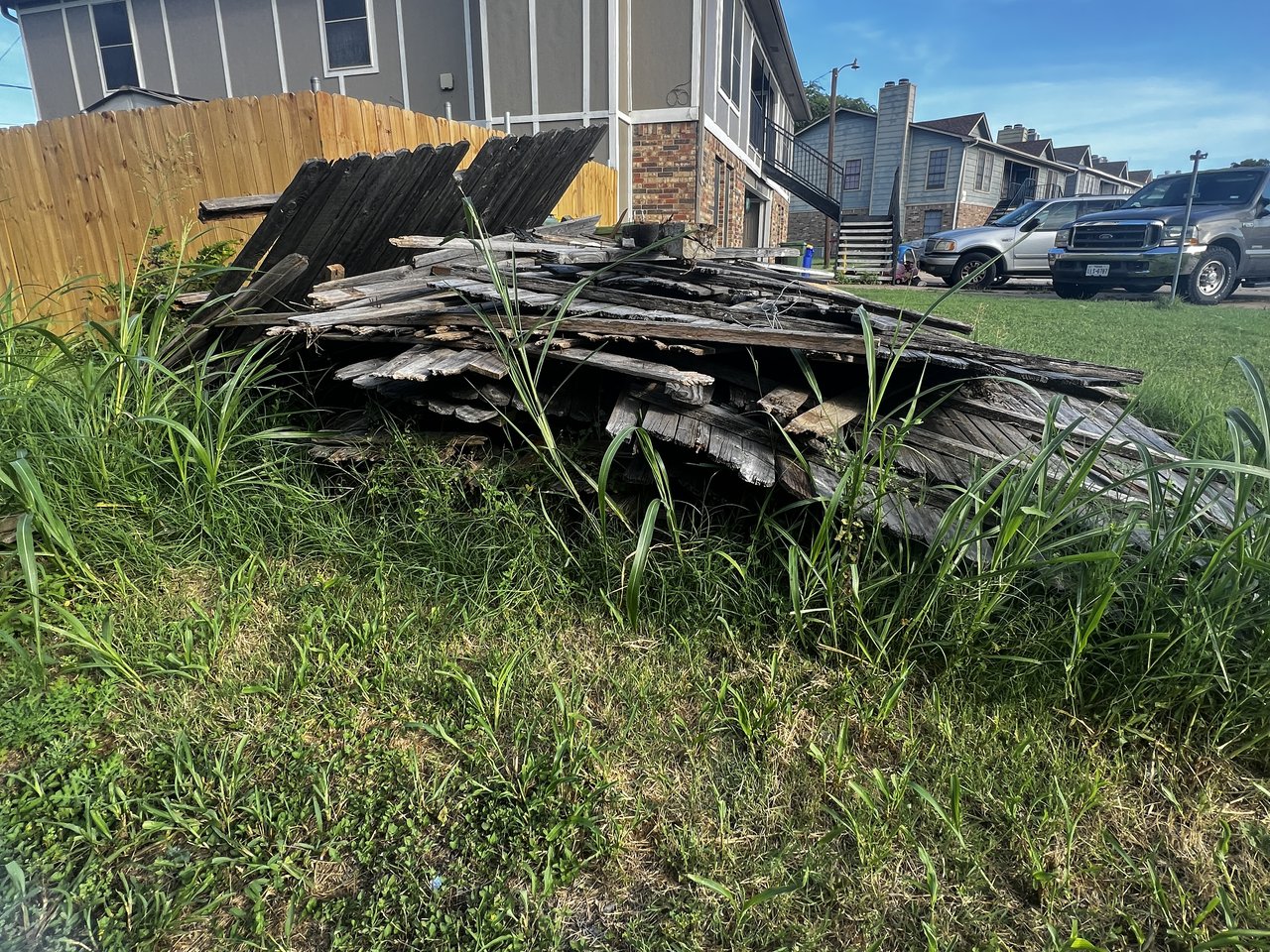 Texas Junk Boyz dump trailer loaded with yard debris and storm damage cleanup